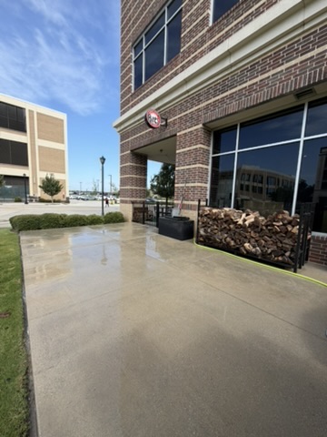 Building exterior hard surfaces after pressure washing, cleaned of grime and buildup