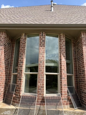 Close-up of residential exterior window glass and frame cleaned in the Carrollton area