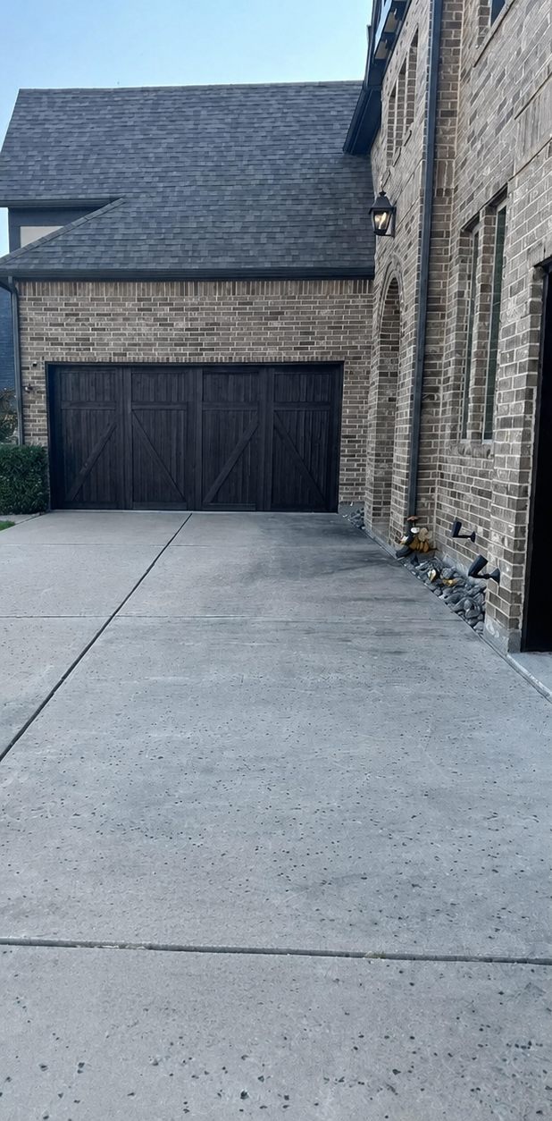 Home exterior and driveway after a complete exterior wash
