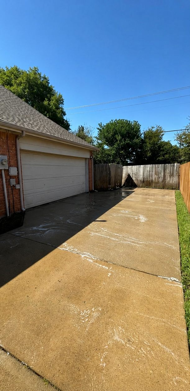 Driveway and garage area after professional pressure washing