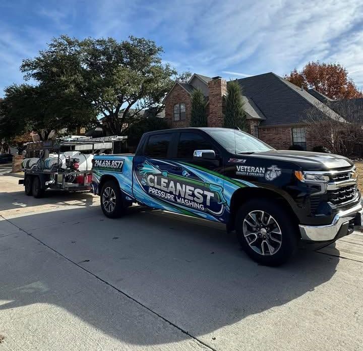 Cleanest Pressure Washing service truck parked on a residential street